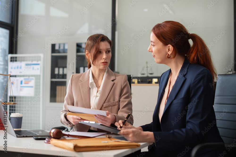 Teamwork of business lawyer meeting working hard about legal legislation in courtroom to help their customer.. Teamwork of business lawyer meeting working hard about legal legislation in courtroom to help their customer..
