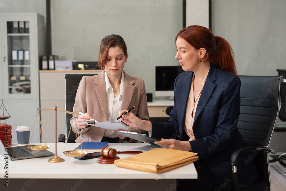 Teamwork of business lawyer meeting working hard about legal legislation in courtroom to help their customer.. Teamwork of business lawyer meeting working hard about legal legislation in courtroom to help their customer..