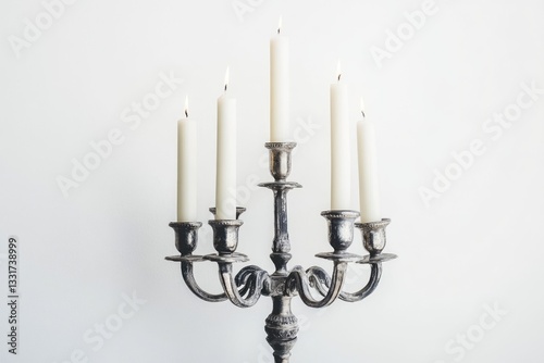 Tarnished Silver Candelabrum with Five White Candles. Chic Antique Style Object on White Wall