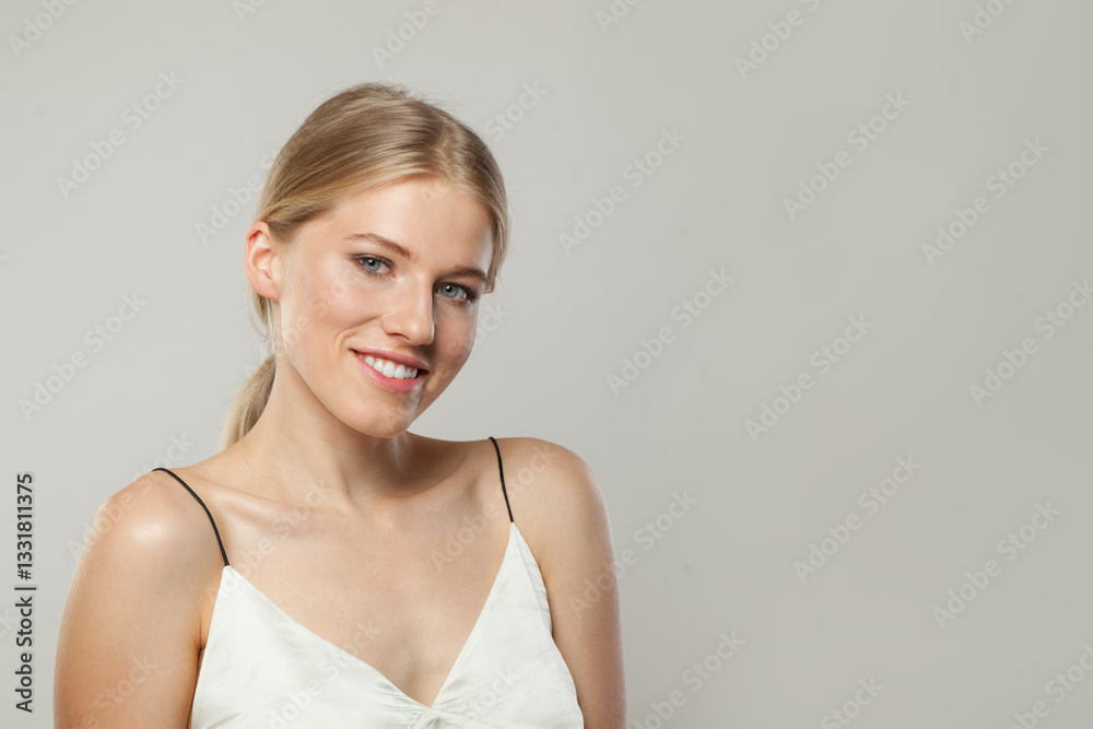 Joyful smiling woman. Female model with blond hairstyle and clean skin, facial treatment, skin care and beauty concept Joyful smiling woman. Female model with blond hairstyle and clean skin, facial treatment, skin care and beauty concept