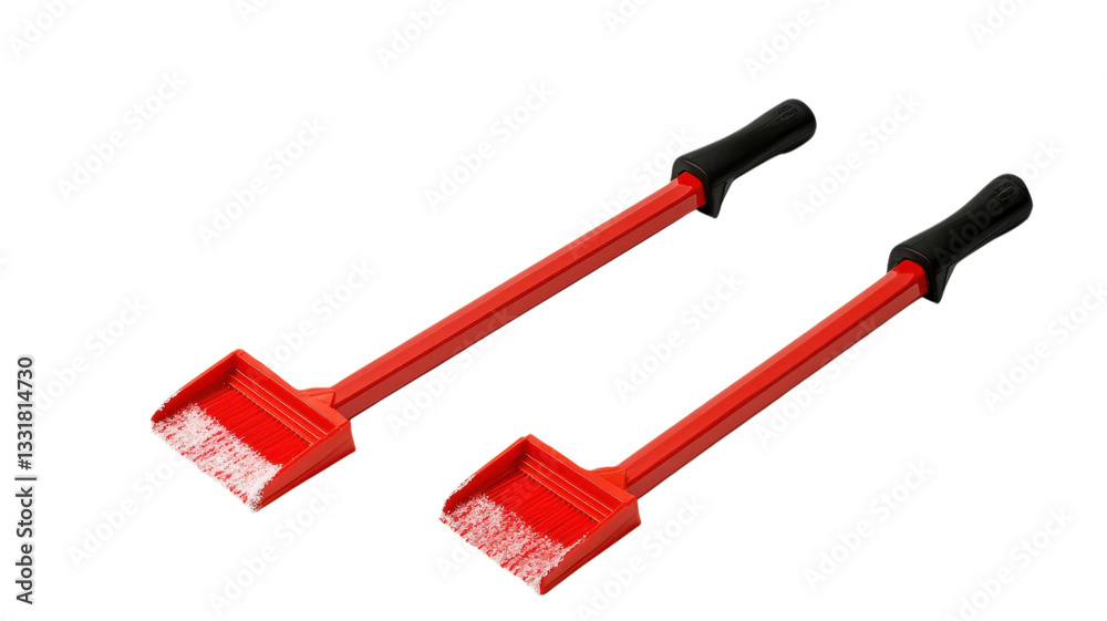 Fototapeta premium Red snow shovel pair designed for efficient snow removal in winter weather conditions