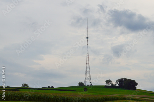 Fototapeta Naklejka Na Ścianę i Meble -  Old antenna tower of the former Landessender Beromuenster medium wave station,  in a beautiful Swiss landscape, on an overcast day.