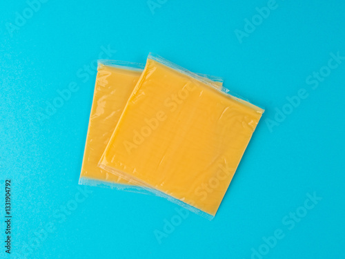 American cheese, processed cheese slice, wrapped thin yellow cheddar in a plastic package