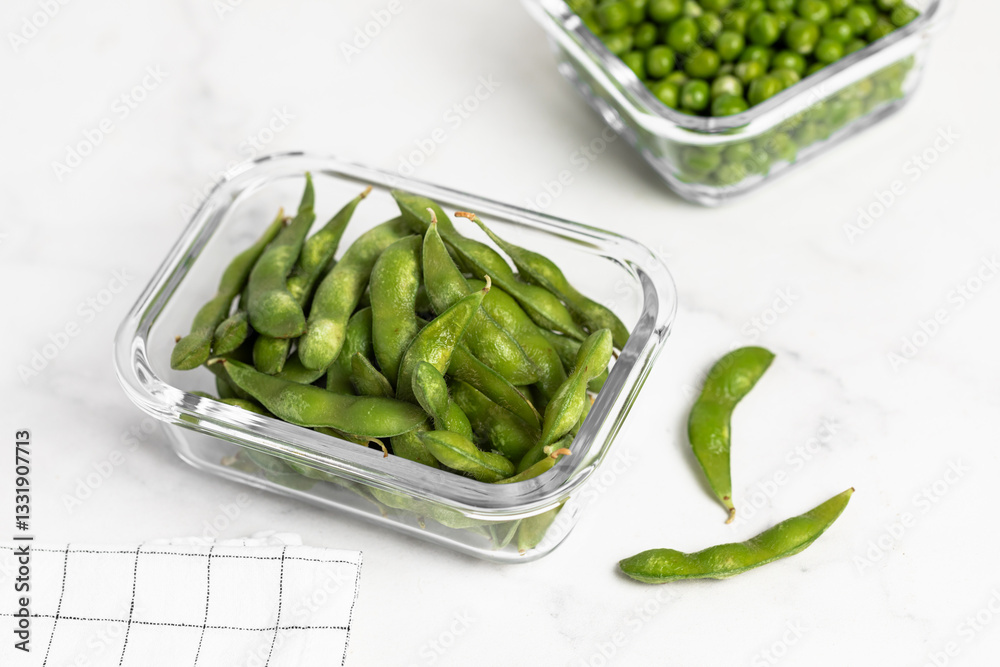green peas in glass container for storage and cooking, healthy lifestyle, vegetable protein, potassium, fiber green peas in glass container for storage and cooking, healthy lifestyle, vegetable protein, potassium, fiber