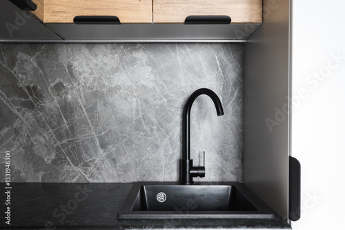 kitchen faucet on a stylish metal sink