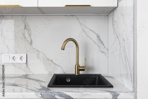 kitchen faucet on a stylish metal sink