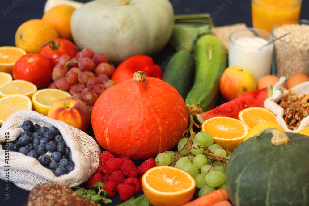 Various healthy fruits, vegetables and cereals on dark background. Selective focus.