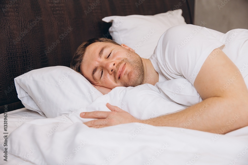Man sleeping peacefully in bed enjoying good night sleep Man sleeping peacefully in bed enjoying good night sleep