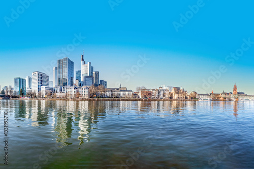 view to modern skyline of Frankfurt wit skyscraper and. with river Main in foreground photo