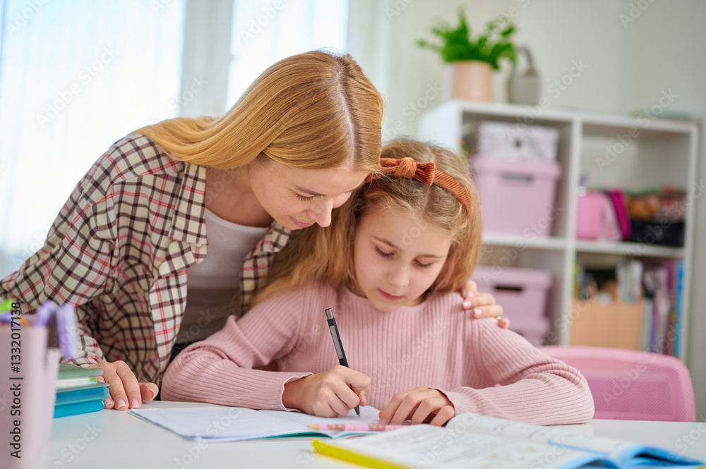Mother and daughter studying together at desk, both focused on textbook, showing interest and engagement in home education process Mother and daughter studying together at desk, both focused on textbook, showing interest and engagement in home education process