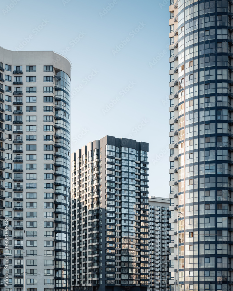 Modern district with residential high-rise buildings. Facades of stylish apartment buildings at sunset. Modern district with residential high-rise buildings. Facades of stylish apartment buildings at sunset.