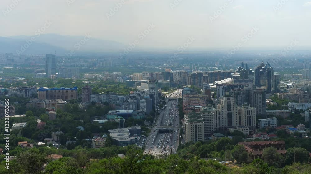 Stunning panoramic view of Almaty from the top of Kok Tobe Hill, city architecture and urban landscape in the heart of the Republic of Kazakhstan
