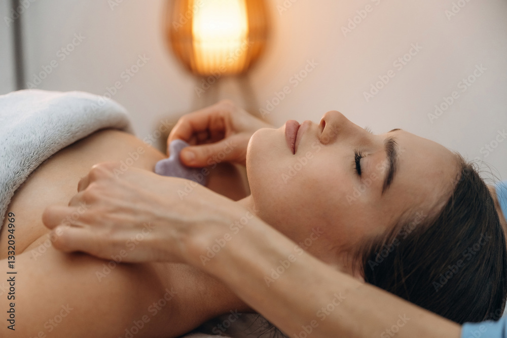 Face patches. Relaxed young woman getting massage by therapist in spa salon Face patches. Relaxed young woman getting massage by therapist in spa salon