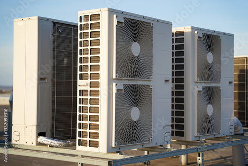 Obraz na płótnie Powerful industrial air conditioning or heat pump outdoor units with two fans, ecological green energy source of heat or cold concept w salonie