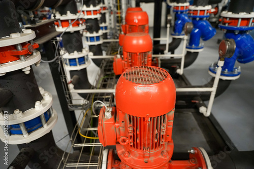 Obraz na płótnie Row of industrial pumps used for refrigeration application to transport coolant, indrustrial refrigeration concept w salonie