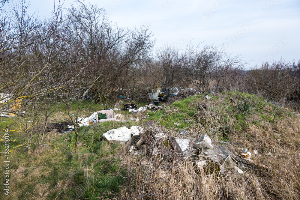 Abandoned garbage, industrial waste, threatening the natural environment.