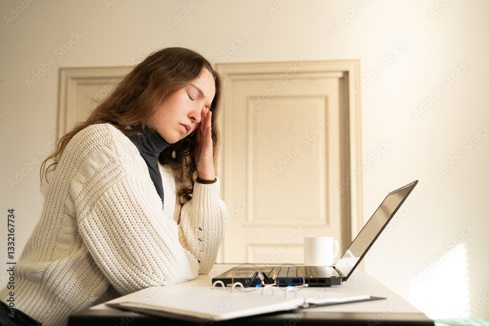 Tired overload young woman suffering from eye strain feeling headache working on a laptop at home office. Unhealthy student girl having dry eyes syndrome. The impact of screens on vision digital era. Tired overload young woman suffering from eye strain feeling headache working on a laptop at home office. Unhealthy student girl having dry eyes syndrome. The impact of screens on vision digital era.