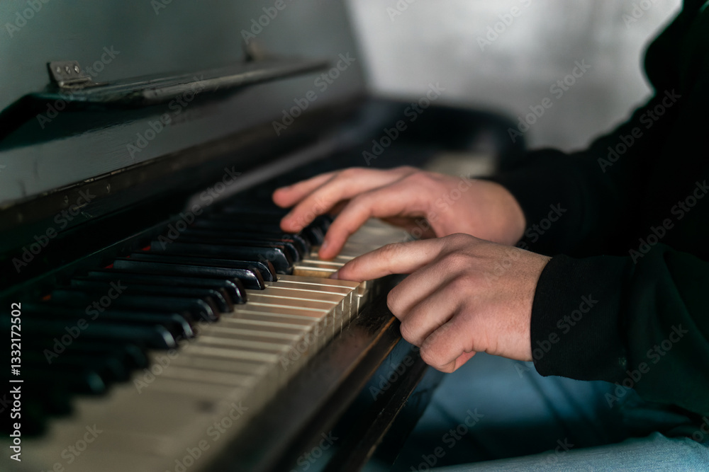 Fototapeta premium Hands gracefully playing the piano, capturing the essence of music, creativity, and artistic expression in a close-up shot
