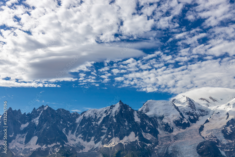 Aiguilles de Chamonix rocky granite mountain peaks in french Alps around Mont Blanc summit in Chamonix valley. Scenic landscape of iconic alpine summits the legends of mountaineering and alpinism