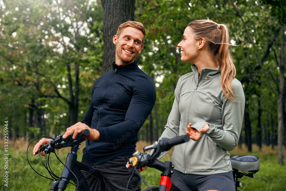 A Couple Happily Enjoying a Scenic Bike Ride Together Amidst Beautiful Nature Surroundings A Couple Happily Enjoying a Scenic Bike Ride Together Amidst Beautiful Nature Surroundings