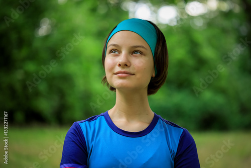 Obraz na płótnie Portrait of beautiful teen girl in sports clothes outdoors in park in summer w salonie