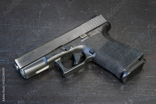 Used firearm, compact 9mm pistol with plastic frame.