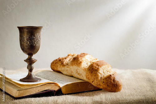 Bread and chalice of wine with copy space background. Maundy Thursday concept.