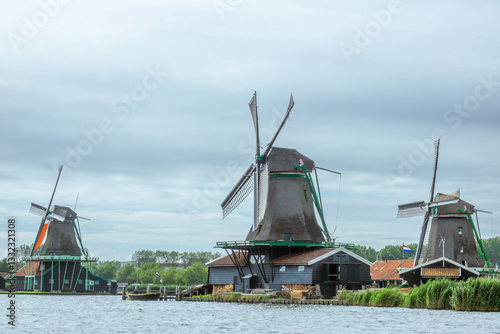 Dutch Windmills on the Bank of a Canal