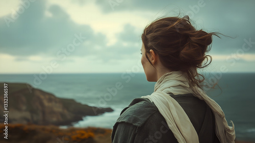 Woman Staring into the Distance on a Cliffside
