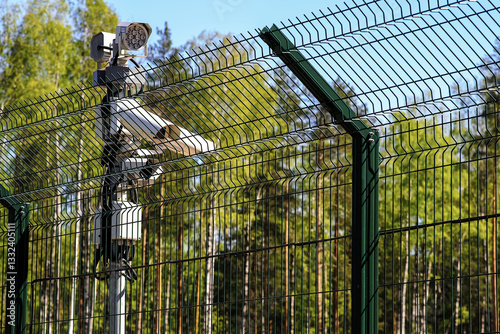 A HighTech Security Fence equipped with an advanced Surveillance Camera for monitoring
