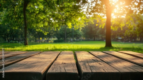 Blurry green park background with empty wooden table for product display - ideal for online advertising & nature store.