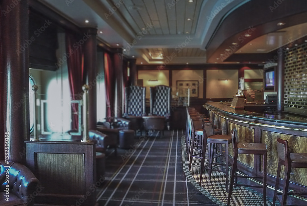 Cozy living room atmosphere inside English British pub bar lounge bistro onboard luxury cruiseship cruise ship ocean liner in contemporary Art Deco interior design