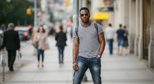 Wallpaper Mural Young african male standing on urban street in casual attire Torontodigital.ca