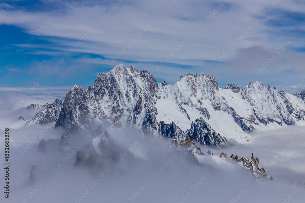 Snow and glacier in the high mountains in the Alps. View of the alpine scenic landscape of rocky summit peaks and glacier ice crevasse from the top of the mountain Aiguille du Midi cable car Chamonix Snow and glacier in the high mountains in the Alps. View of the alpine scenic landscape of rocky summit peaks and glacier ice crevasse from the top of the mountain Aiguille du Midi cable car Chamonix