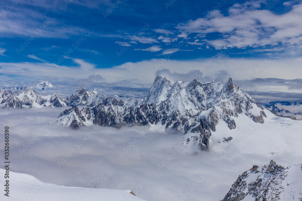 Snow and glacier in the high mountains in the Alps. View of the alpine scenic landscape of rocky summit peaks and glacier ice crevasse from the top of the mountain Aiguille du Midi cable car Chamonix Snow and glacier in the high mountains in the Alps. View of the alpine scenic landscape of rocky summit peaks and glacier ice crevasse from the top of the mountain Aiguille du Midi cable car Chamonix