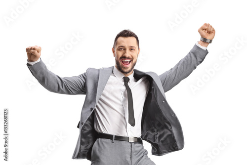 Excited young businessman in a grey suit jumping