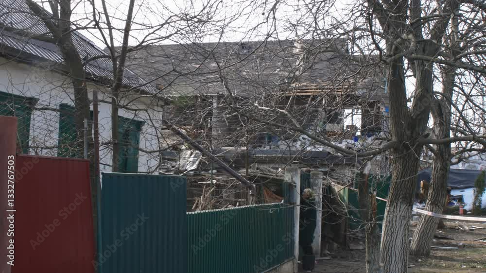 Consequences of military actions, destroyed building, close-up. Damage to walls, roof and windows is visible. Destruction of a residential building. War in Ukraine. Shelling of civilians. Consequences of military actions, destroyed building, close-up. Damage to walls, roof and windows is visible. Destruction of a residential building. War in Ukraine. Shelling of civilians.