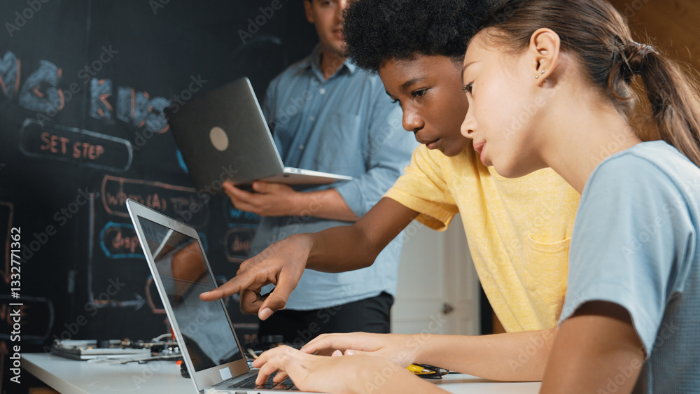 Caucasian girl programing or coding system while african boy fixing model. Teacher holding laptop while looking at diverse children writing web develop program. Innovation education. Edification. Caucasian girl programing or coding system while african boy fixing model. Teacher holding laptop while looking at diverse children writing web develop program. Innovation education. Edification.