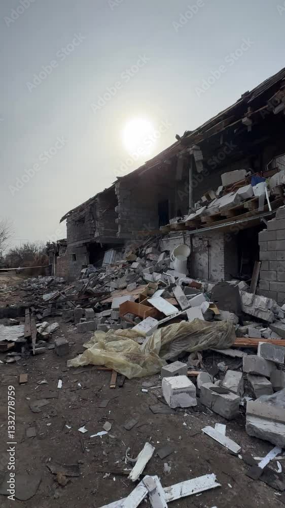 Consequences of military actions, destroyed building, close-up. Damage to walls, roof and windows is visible. Destruction of a residential building. War in Ukraine. Shelling of civilians. Consequences of military actions, destroyed building, close-up. Damage to walls, roof and windows is visible. Destruction of a residential building. War in Ukraine. Shelling of civilians.