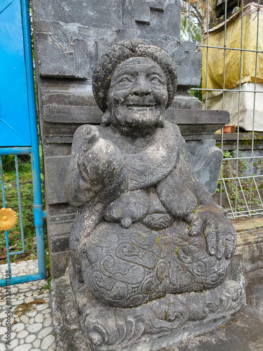 A stone statue that symbolizes the guard of the gate of a house or palace