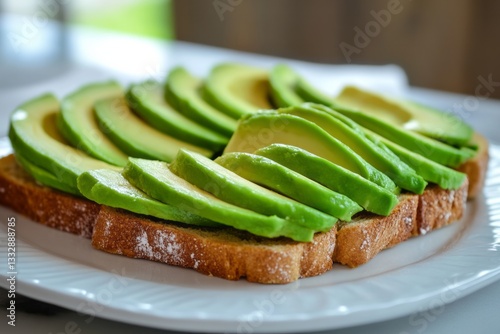 Deliciously prepared avocado toast served on a white plate to enjoy at breakfast or brunch in a cozy setting