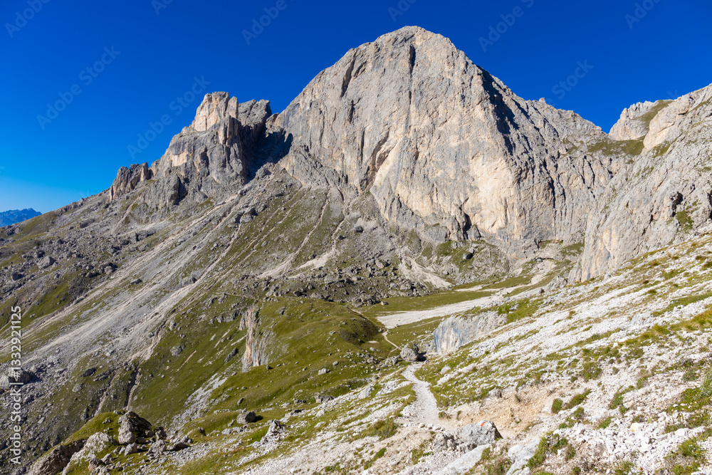 Dolomite Alps mountains in Europe beautiful landscape photo. Stunning rocky peaks of Dolomiti Alps under clear blue sky cliffs and climbing walls of European Alps scenic view Dolomite Alps mountains in Europe beautiful landscape photo. Stunning rocky peaks of Dolomiti Alps under clear blue sky cliffs and climbing walls of European Alps scenic view