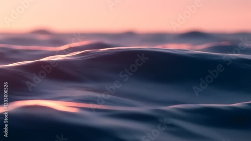 Serene ocean waves at sunset, with soft pink hues reflecting on the water's surface, creating a tranquil atmosphere
