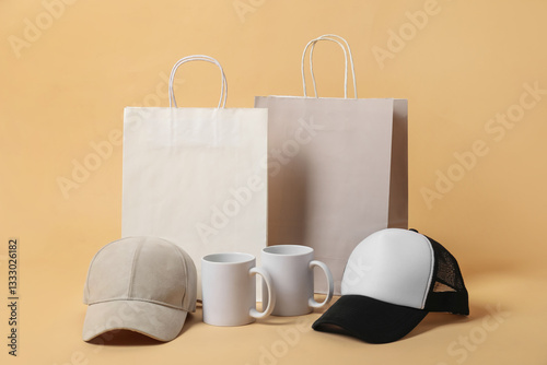 Different blank items for branding on beige background. Mockup for design