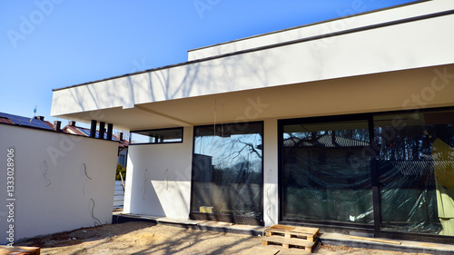 Single family house construction site. Modern designed single-family house under construction.