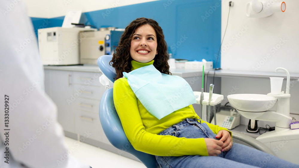 Fototapeta premium Young woman sitting on a dental chair