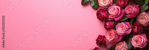 A pink background adorned with multiple beautiful roses.