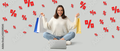 Young woman with laptop and...