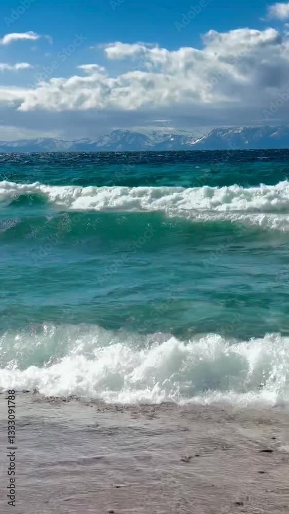 Vertical Video: Magnificent Blue Waves on the Beach Ocean Shore. Beautiful and Powerful Wild Nature & Seashore. Windy Day with Sunny Clouds. Vertical Video: Magnificent Blue Waves on the Beach Ocean Shore. Beautiful and Powerful Wild Nature & Seashore. Windy Day with Sunny Clouds.