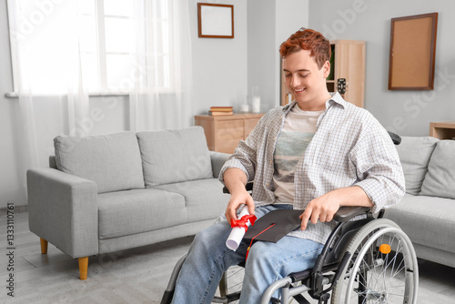 Male graduate in wheelchair...